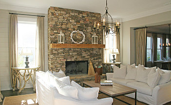 decoration-stacked-stone-fireplace-in-the-modern-living-room-with-white-sofa-set-and-chandelier-and-wooden-flooring-and-white-color-of-wall-and-ceiling-paint-build-a-country-stacked-dry-stone-fireplace-s
