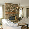 decoration-stacked-stone-fireplace-in-the-modern-living-room-with-white-sofa-set-and-chandelier-and-wooden-flooring-and-white-color-of-wall-and-ceiling-paint-build-a-country-stacked-dry-stone-fireplace-s